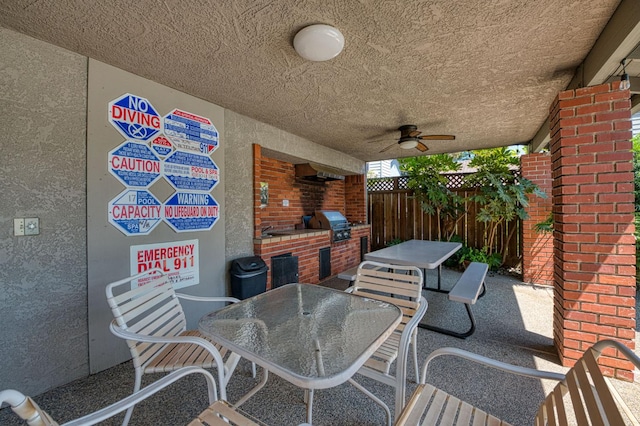 7047 N Teilman Ave Unit 102, Fresno, CA 93711 - view of patio / terrace with outdoor dining area, exterior kitchen, and a ceiling fan