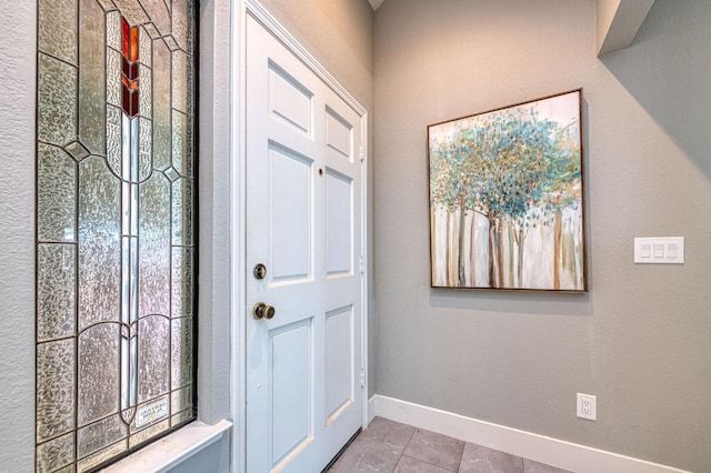 7047 N Teilman Ave Unit 102, Fresno, CA 93711 - entryway with baseboards and tile patterned floors