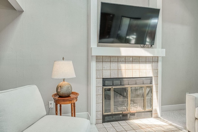 7047 N Teilman Ave Unit 102, Fresno, CA 93711 - detailed view of baseboards and a tiled fireplace