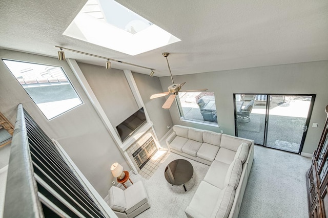 7047 N Teilman Ave Unit 102, Fresno, CA 93711 - living room with a skylight, a textured ceiling, and a ceiling fan