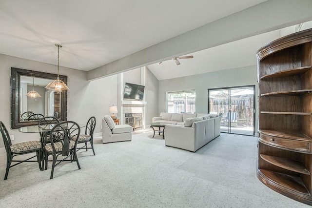 7047 N Teilman Ave Unit 102, Fresno, CA 93711 - dining space featuring lofted ceiling, a tile fireplace, carpet floors, and ceiling fan