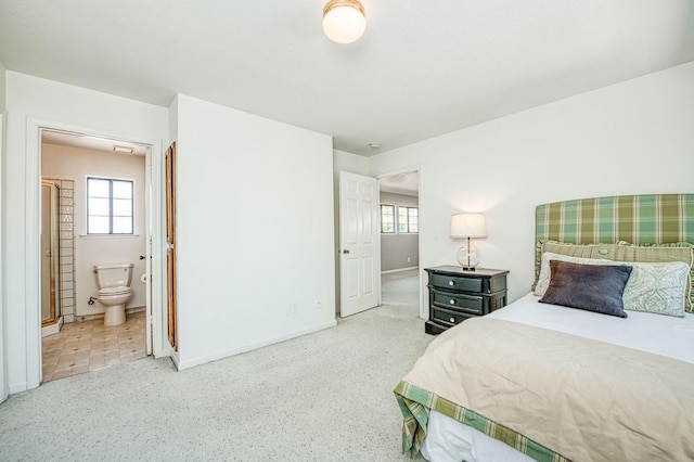 7047 N Teilman Ave Unit 102, Fresno, CA 93711 - bedroom featuring multiple windows, carpet, and connected bathroom
