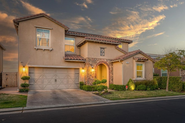 4367 Salem Ln, Clovis, CA 93619 - mediterranean / spanish-style home with a tiled roof, stucco siding, an attached garage, and driveway