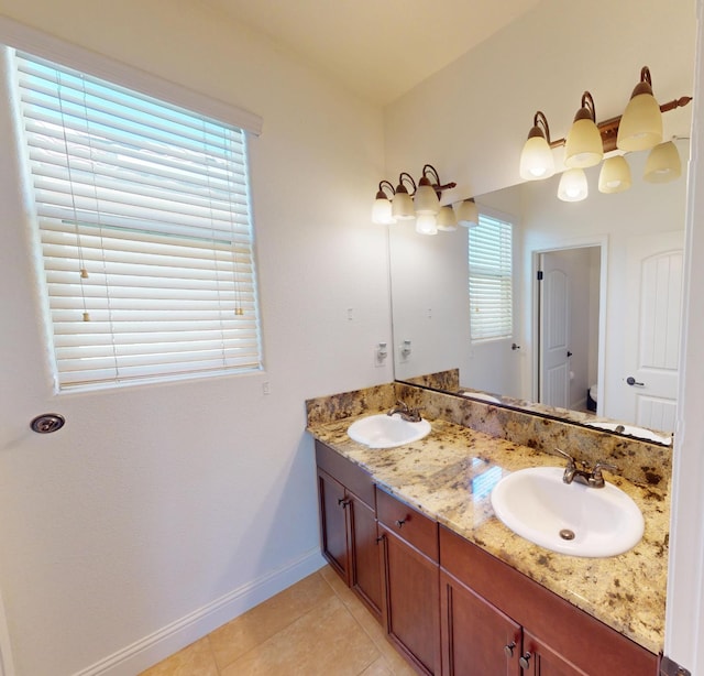 4367 Salem Ln, Clovis, CA 93619 - bathroom featuring double vanity, tile patterned flooring, and healthy amount of natural light