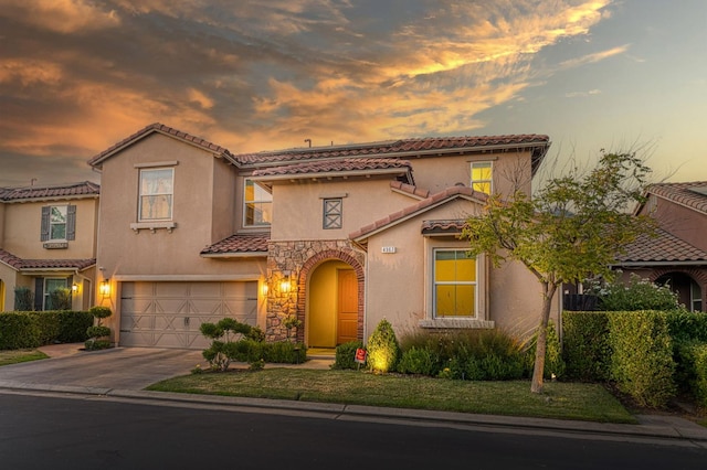 4367 Salem Ln, Clovis, CA 93619 - mediterranean / spanish house featuring a tile roof, driveway, a garage, and stucco siding