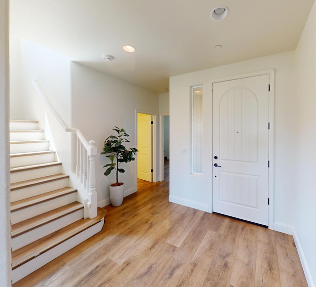 4367 Salem Ln, Clovis, CA 93619 - foyer entrance with light wood finished floors, stairway, and recessed lighting