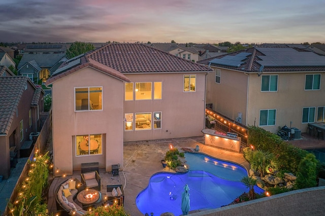 4367 Salem Ln, Clovis, CA 93619 - back of house featuring a fire pit, stucco siding, a tile roof, and a fenced backyard