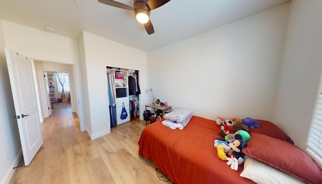 4367 Salem Ln, Clovis, CA 93619 - bedroom with light wood finished floors, multiple windows, a closet, and a ceiling fan