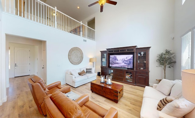 4367 Salem Ln, Clovis, CA 93619 - living area with a towering ceiling, a ceiling fan, and light wood-style floors