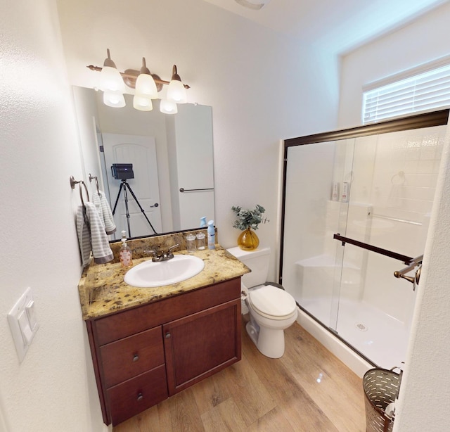 4367 Salem Ln, Clovis, CA 93619 - full bathroom with wood finished floors, a shower stall, and vanity
