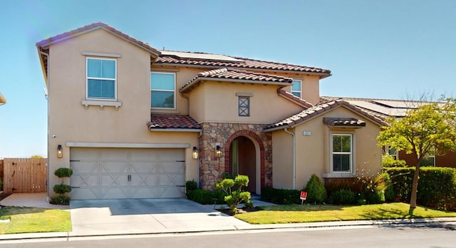 4367 Salem Ln, Clovis, CA 93619 - mediterranean / spanish home featuring stucco siding, a garage, concrete driveway, and a tiled roof