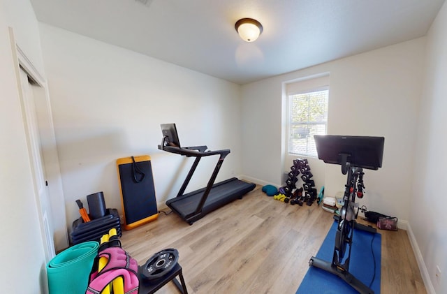 4367 Salem Ln, Clovis, CA 93619 - workout room with wood finished floors and baseboards