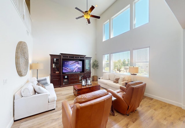 4367 Salem Ln, Clovis, CA 93619 - living room with a high ceiling, a ceiling fan, and light wood finished floors
