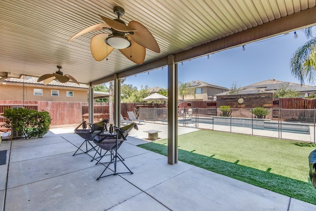 7230 E Dayton Ave, Fresno, CA 93737 - fenced backyard with a patio and a ceiling fan