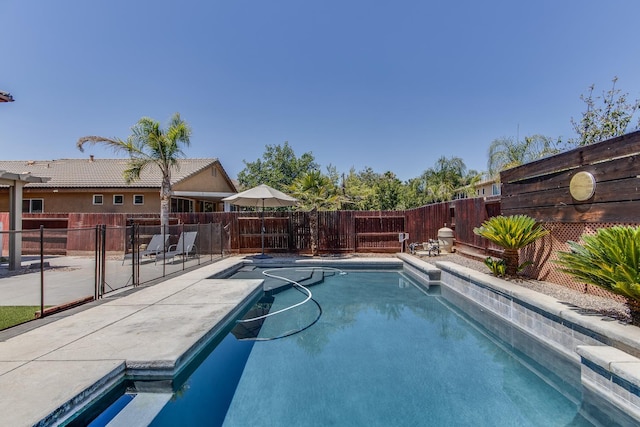 7230 E Dayton Ave, Fresno, CA 93737 - view of pool with a fenced backyard and a patio