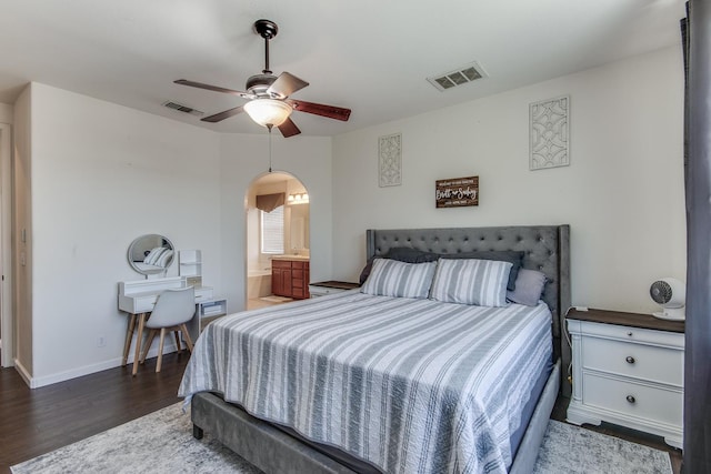 7230 E Dayton Ave, Fresno, CA 93737 - bedroom with wood finished floors, arched walkways, ensuite bath, and a ceiling fan
