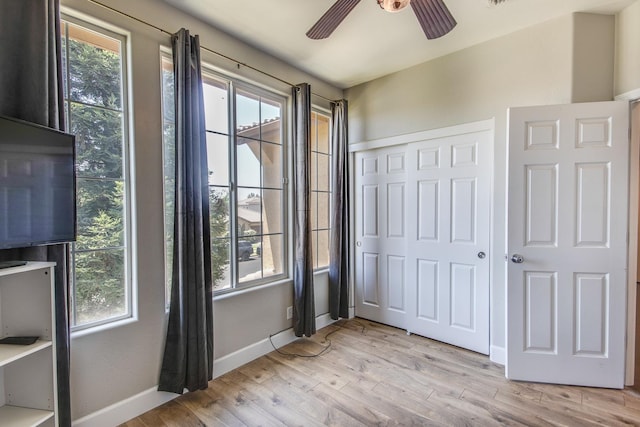 7230 E Dayton Ave, Fresno, CA 93737 - unfurnished bedroom with a closet, light wood finished floors, and a ceiling fan