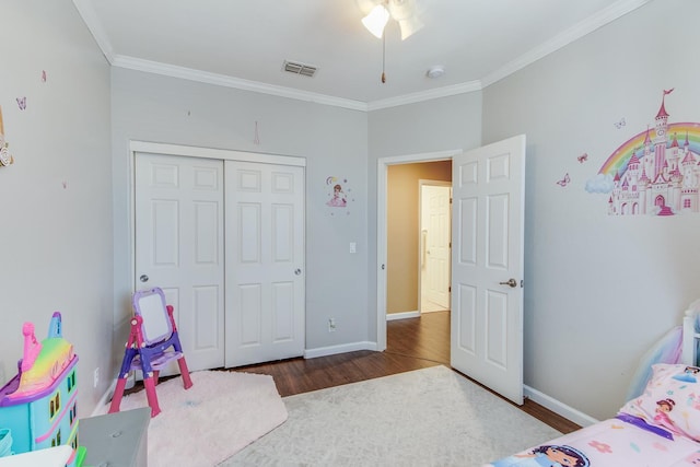 7230 E Dayton Ave, Fresno, CA 93737 - bedroom featuring wood finished floors, ornamental molding, and a closet