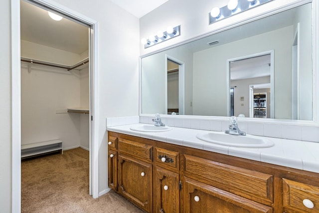 2076 W Calimyrna Ave Unit 102, Fresno, CA 93711 - bathroom with double vanity and a spacious closet