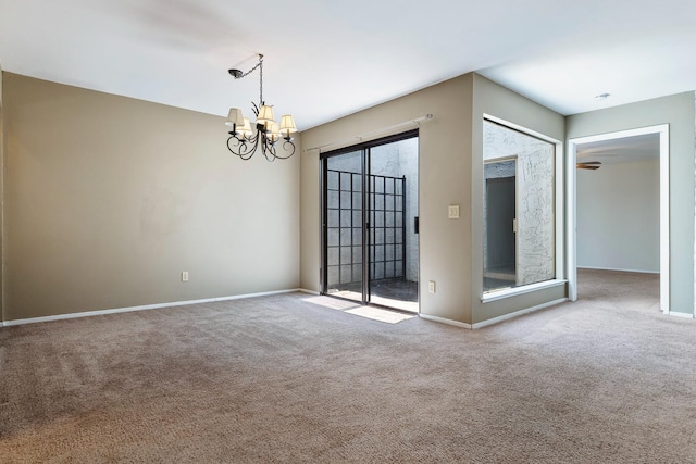 2076 W Calimyrna Ave Unit 102, Fresno, CA 93711 - carpeted spare room featuring a chandelier and baseboards