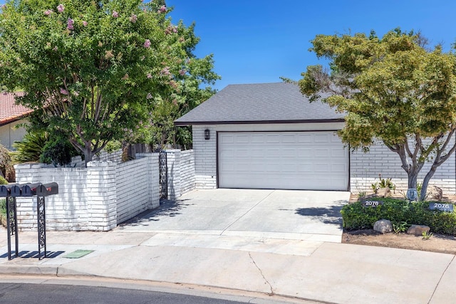 2076 W Calimyrna Ave Unit 102, Fresno, CA 93711 - view of front of property featuring brick siding, driveway, and a garage