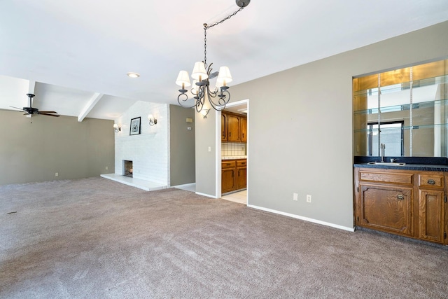 2076 W Calimyrna Ave Unit 102, Fresno, CA 93711 - unfurnished living room featuring a chandelier, light carpet, a ceiling fan, and a fireplace