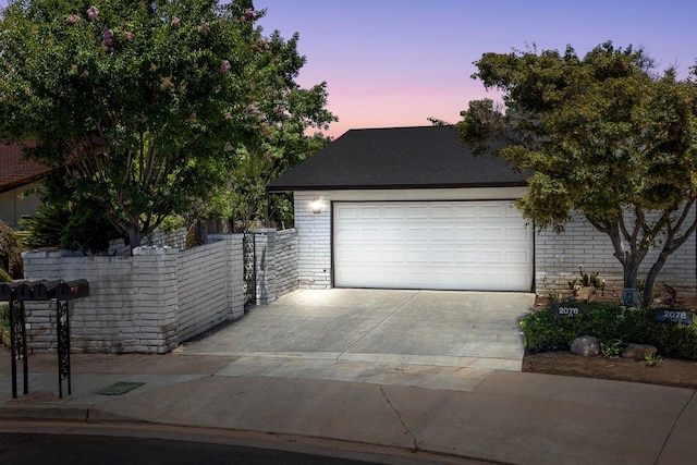 2076 W Calimyrna Ave Unit 102, Fresno, CA 93711 - view of front of house featuring driveway, brick siding, and a garage