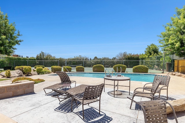 2076 W Calimyrna Ave Unit 102, Fresno, CA 93711 - view of swimming pool featuring a patio area