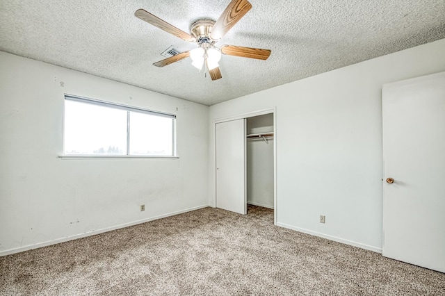 11016 E S Ave, Selma, CA 93662 - unfurnished bedroom with a textured ceiling, carpet flooring, a closet, and a ceiling fan