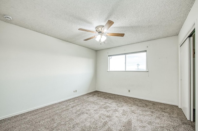 11016 E S Ave, Selma, CA 93662 - unfurnished bedroom with a closet, a textured ceiling, carpet floors, and a ceiling fan