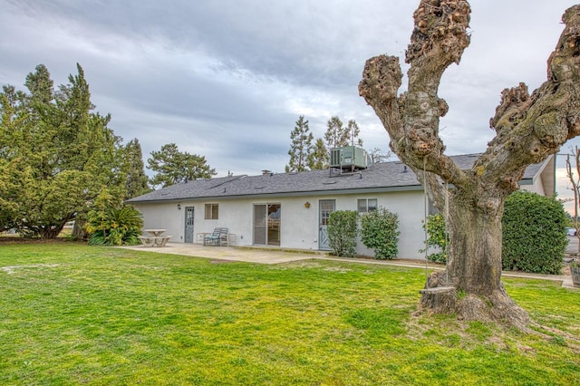 11016 E S Ave, Selma, CA 93662 - rear view of property featuring stucco siding, a patio, and a yard