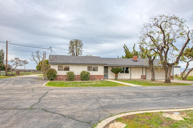 11016 E S Ave, Selma, CA 93662 - ranch-style home featuring a chimney and brick siding