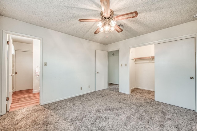 11016 E S Ave, Selma, CA 93662 - unfurnished bedroom featuring carpet flooring, a textured ceiling, a closet, and ceiling fan