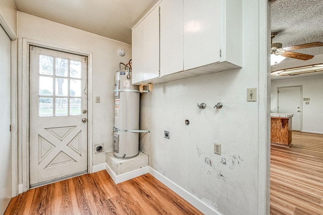 11016 E S Ave, Selma, CA 93662 - washroom with cabinet space, hookup for an electric dryer, strapped water heater, a ceiling fan, and light wood finished floors