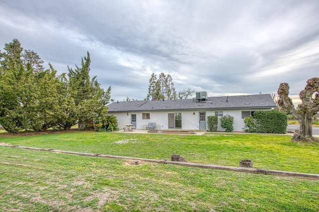 11016 E S Ave, Selma, CA 93662 - back of house with a patio area, stucco siding, and a lawn