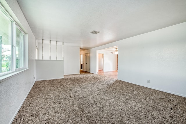 11016 E S Ave, Selma, CA 93662 - carpeted empty room featuring baseboards and ceiling fan