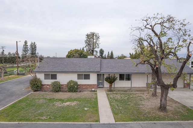 11016 E S Ave, Selma, CA 93662 - ranch-style home featuring a shingled roof, a front lawn, and brick siding