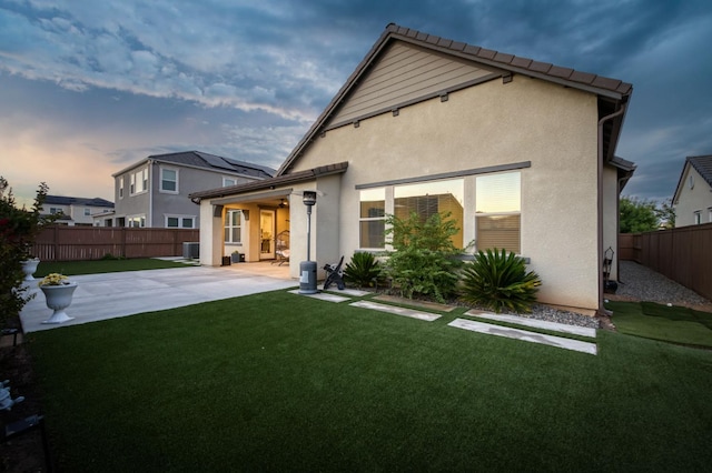 682 Parsons Way S, Madera, CA 93636 - back of property featuring a patio area, a fenced backyard, and stucco siding
