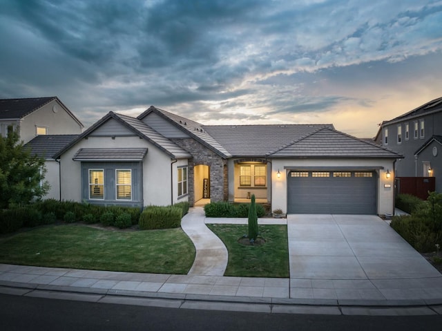 682 Parsons Way S, Madera, CA 93636 - view of front of home with stucco siding, a garage, a front lawn, and driveway