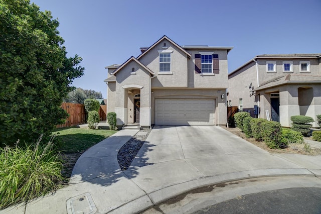 4001 W Fig Tree Ln, Fresno, CA 93722 - traditional-style house with concrete driveway, stucco siding, and a garage
