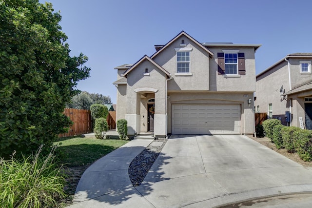 4001 W Fig Tree Ln, Fresno, CA 93722 - traditional-style house with stucco siding, concrete driveway, and a garage