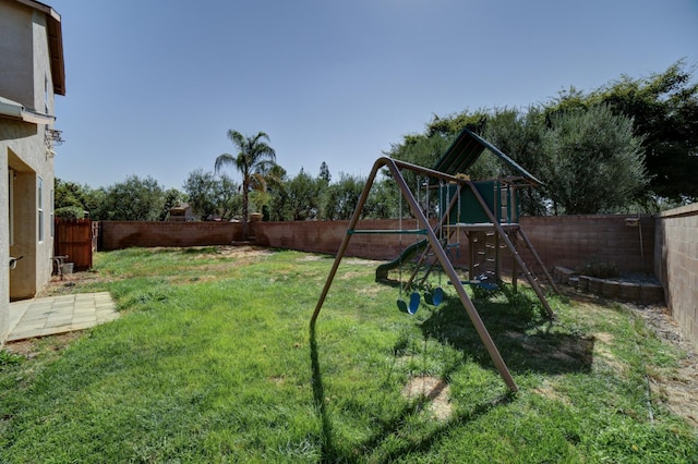 4001 W Fig Tree Ln, Fresno, CA 93722 - fenced backyard with a playground