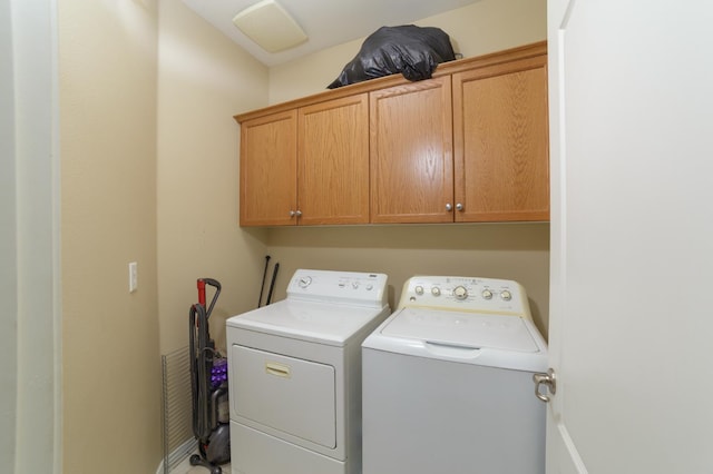 4001 W Fig Tree Ln, Fresno, CA 93722 - laundry room with cabinet space and washing machine and clothes dryer