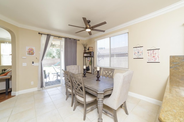 4001 W Fig Tree Ln, Fresno, CA 93722 - dining space featuring arched walkways, ornamental molding, a ceiling fan, and light tile patterned floors