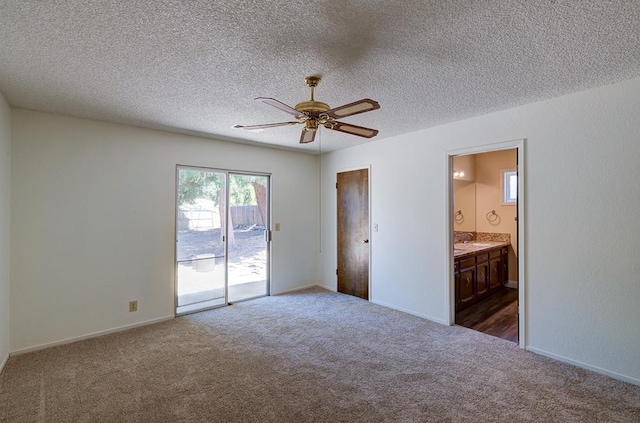 41151 Fig Grove Cir, Madera, CA 93636 - unfurnished bedroom with access to outside, dark colored carpet, a textured ceiling, ensuite bathroom, and a ceiling fan