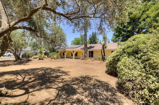 41151 Fig Grove Cir, Madera, CA 93636 - view of front of home featuring solar panels and stucco siding
