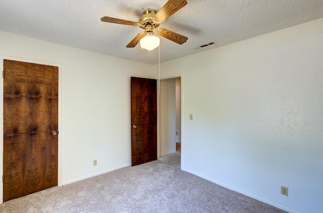41151 Fig Grove Cir, Madera, CA 93636 - unfurnished bedroom featuring carpet, a ceiling fan, and a textured ceiling