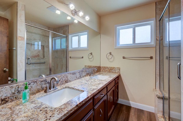 41151 Fig Grove Cir, Madera, CA 93636 - full bathroom with wood finished floors, double vanity, and a shower stall