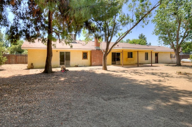 41151 Fig Grove Cir, Madera, CA 93636 - rear view of property with a patio area and a chimney