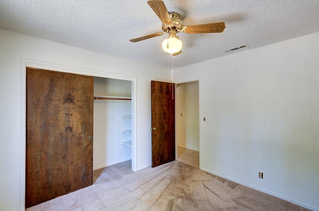 41151 Fig Grove Cir, Madera, CA 93636 - unfurnished bedroom with carpet, a textured ceiling, a closet, and ceiling fan